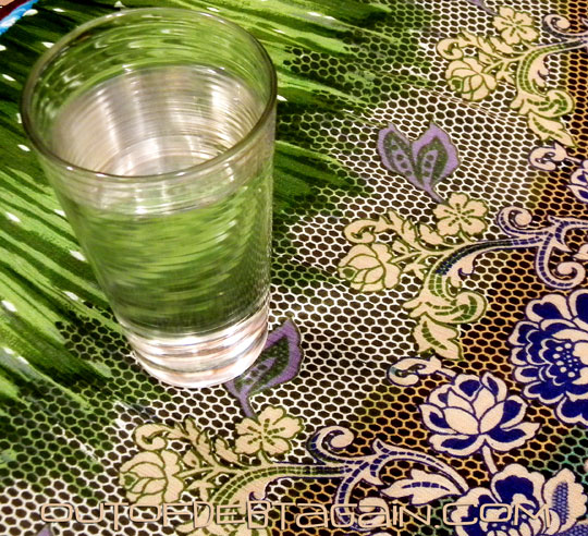 Glass of Water on a Pretty Tablecloth